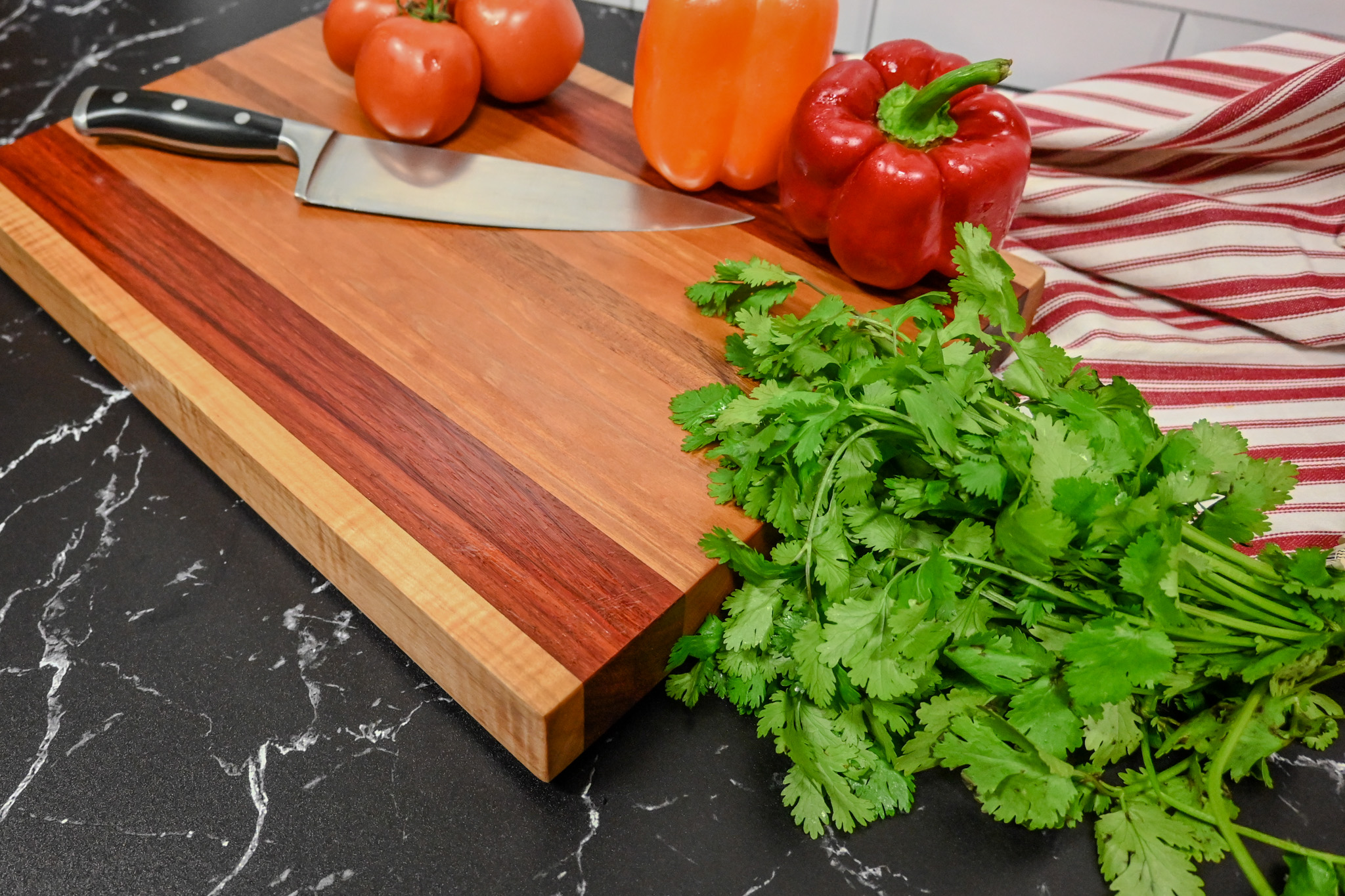 Paduk, Cherry and Curly Maple Edge Grain Cutting Board - Image 1